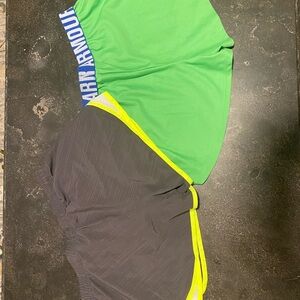 Two pairs of Under Armor running shorts